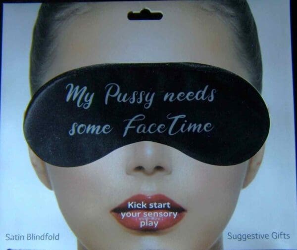 A woman with a blindfold on her face.