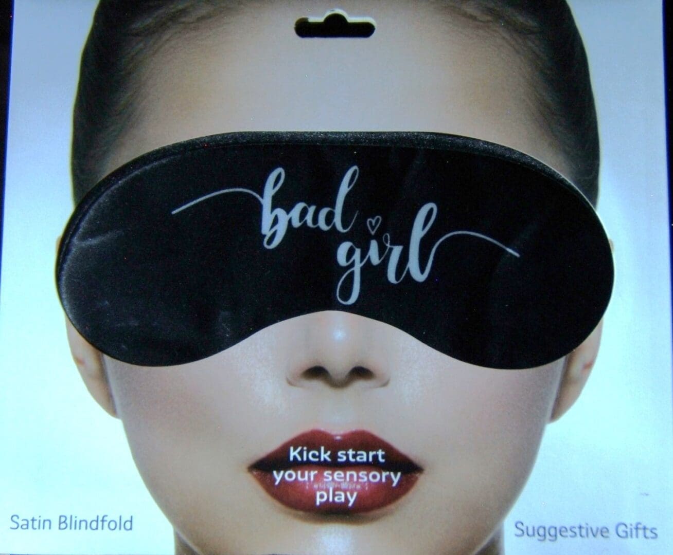 A woman wearing a blindfold and lipstick.