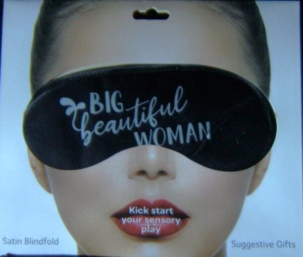 A woman wearing a black eye mask with the words " big beautiful woman ".