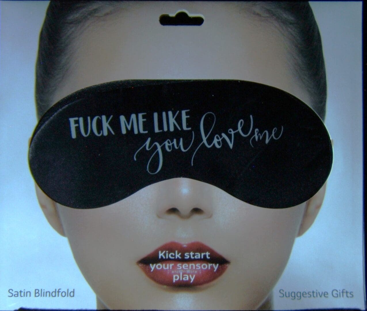 A woman with a blindfold on her eyes.