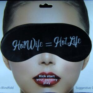 A woman wearing a black eye mask with the words " hot wife = hotlife ".