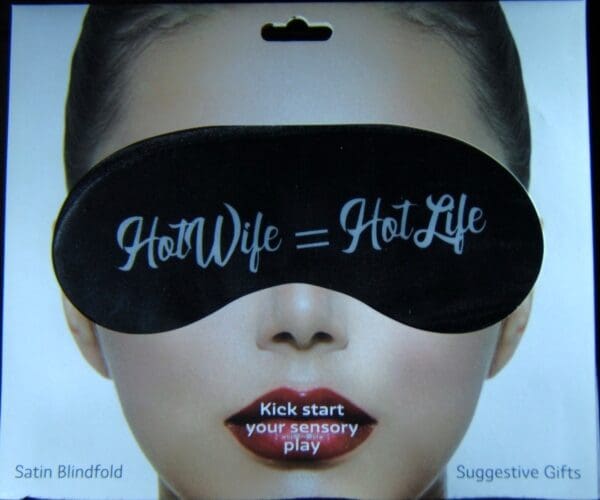 A woman wearing a black eye mask with the words " hot wife = hotlife ".