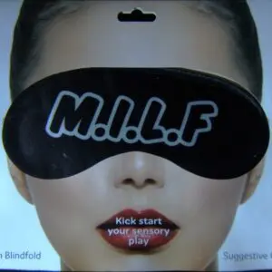 A woman wearing a black eye mask with the word " milf " written on it.