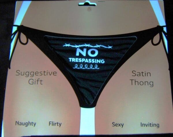 A black and white bikini with the words " no trespassing ".