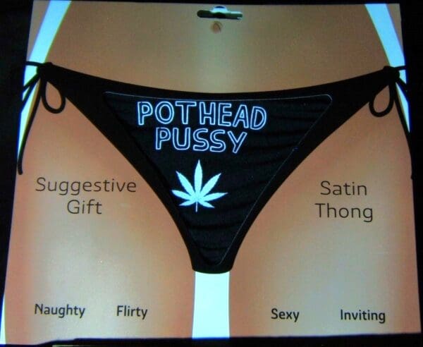 A black and white picture of some panties with the words pothead pussy written on them.