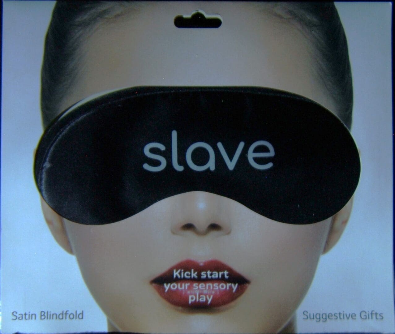 A woman wearing a blindfold and text reading " slave ".