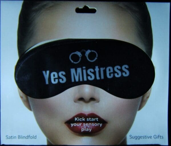 A woman wearing a blindfold and text " yes mistress ".