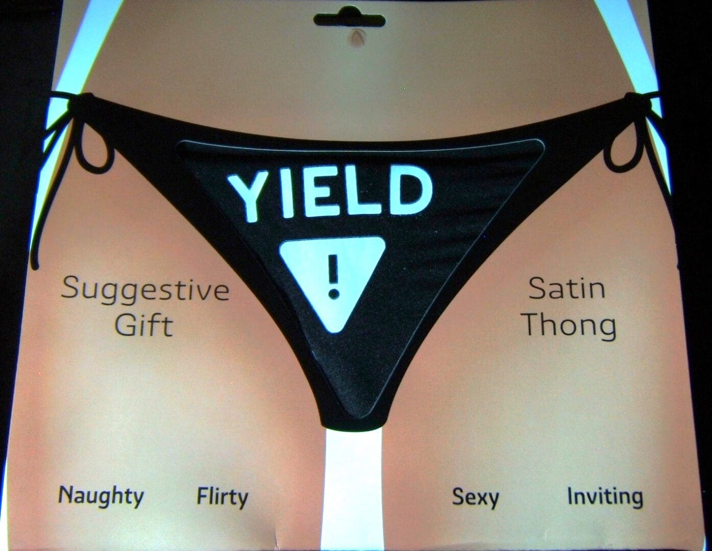 A black and white picture of a thong with the word yield written on it.